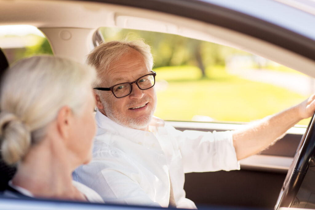 elderly couple in a car